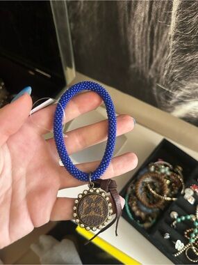Blue Beaded Bracelet with Brown Medallion Charm